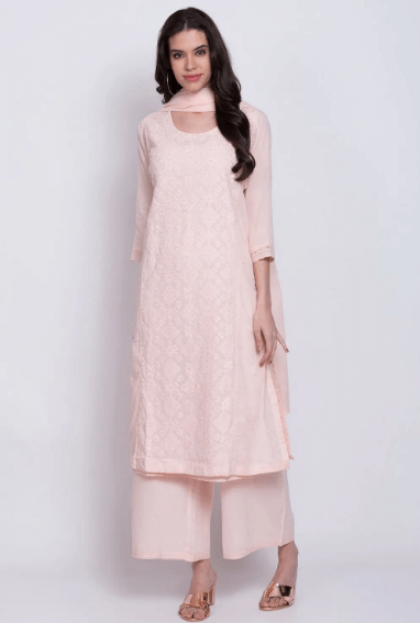 A girl wearing pink Salwar Kameez