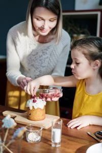 Mothers day 2020 - Girl in Yellow Shirt Holding Brown Cake-min