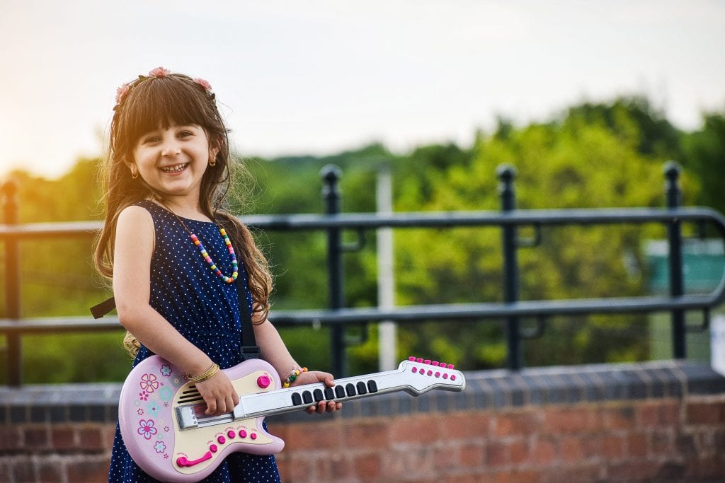 Mothers day 2020 -Little Happy Girl Playing Guitar-min